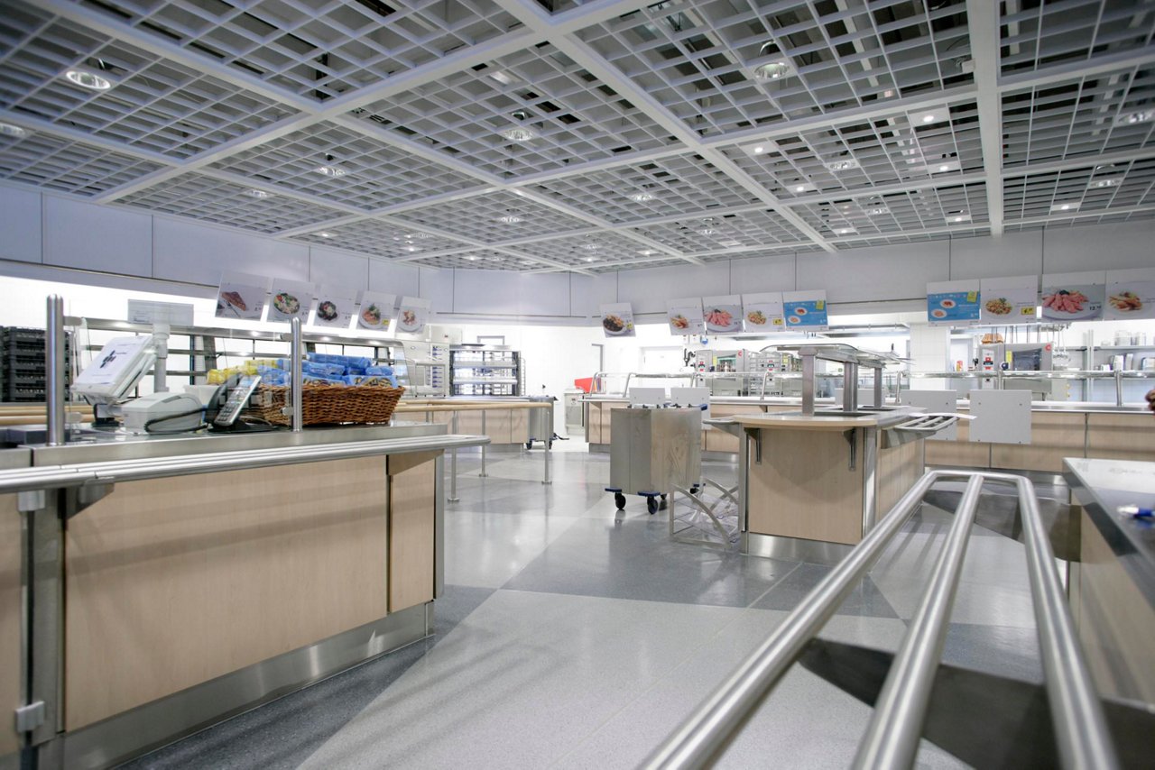 A scatter-style serving area for employees in a large company cafeteria