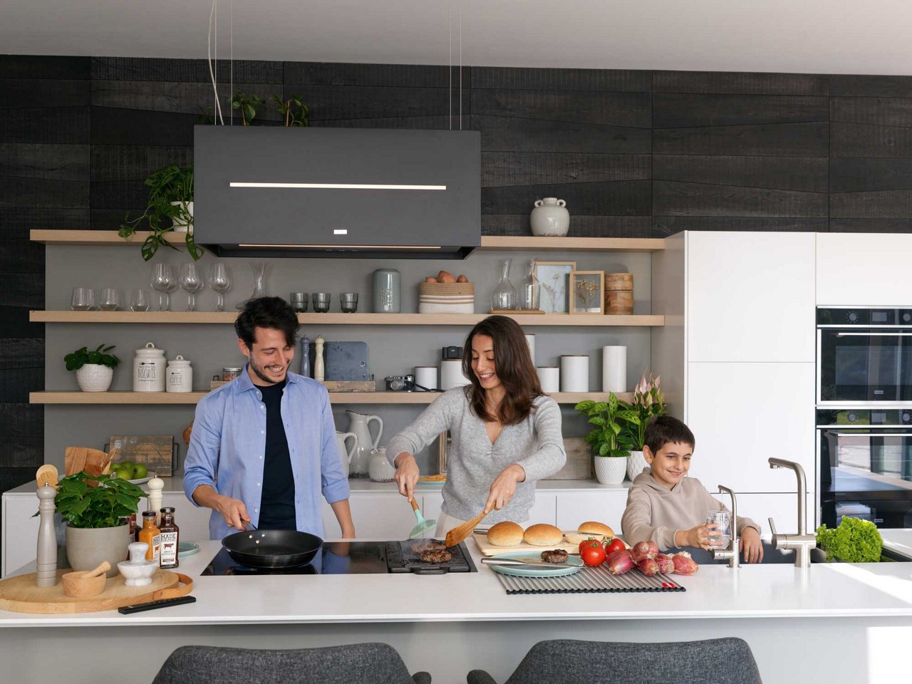 Family cooking together in a contemporary kitchen