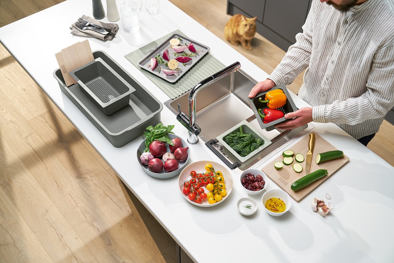 Man chopping vegetables using the All-In Accessory Set