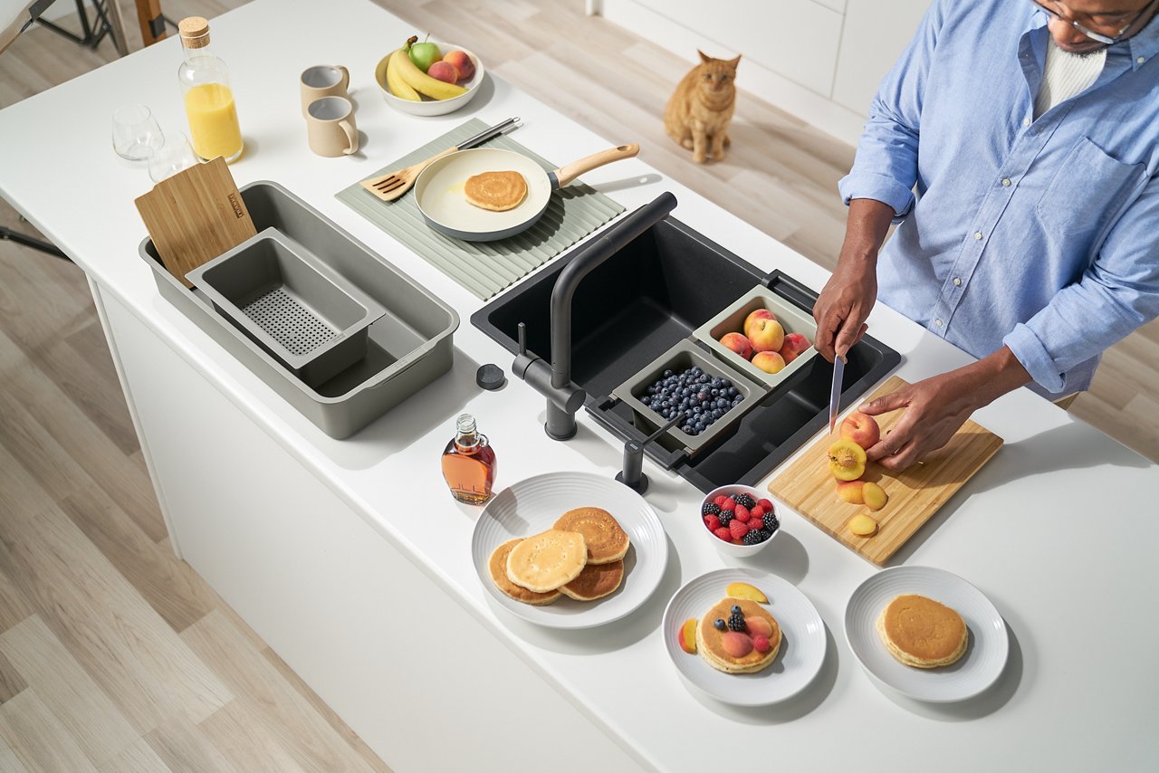 People standing in a kitchen and cooking