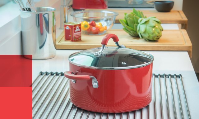 Pot sitting on a Kindred roller mat on a kitchen counter 