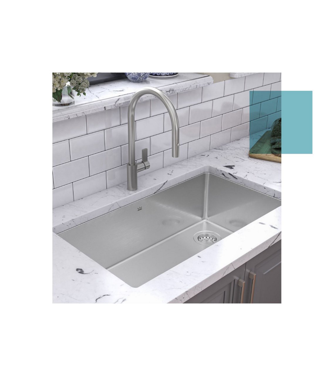 Large stainless steel single bowl undermount kitchen sink with a stainless steel faucet