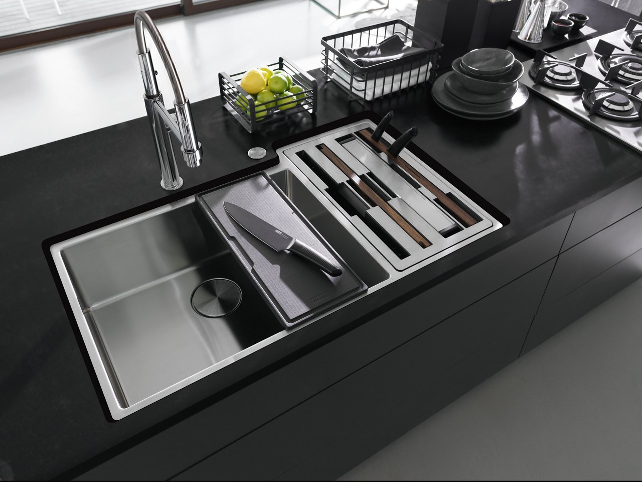 Culinary Center stainless steel workstation sink with built in accessory storage paired with a Pescara faucet in chrome