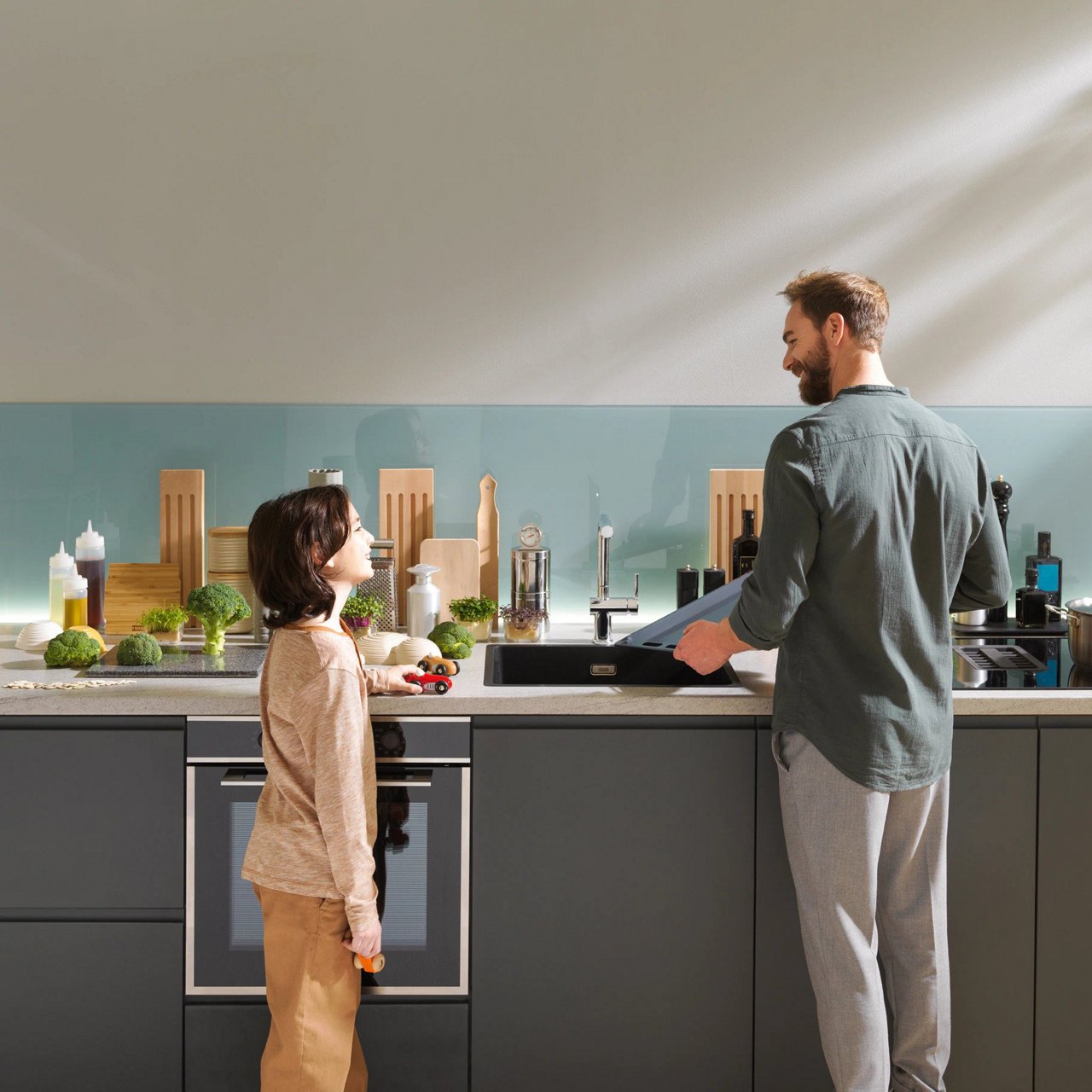 Dad and kid in front of a Franke kitchen