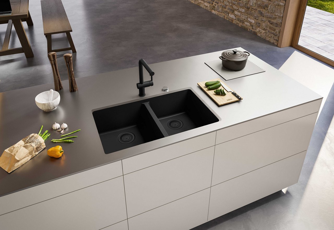 Kitchen island with a double bowl matte black undermount granite sink