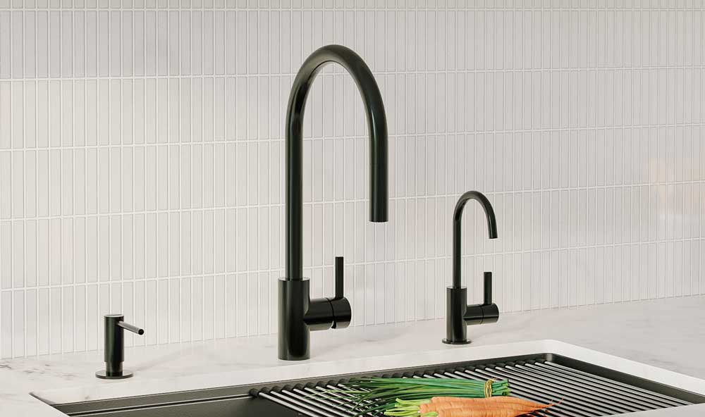 Franke Black pull down faucet with coordinating black filtered water dispenser and black soap dispenser in a white modern kitchen