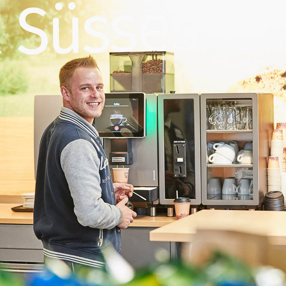 Franke Coffee Systems & Landi, self service station, self-serve coffee, man having a coffee, coffee to go, convenience store