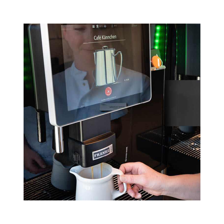 Barmelweid & Franke Coffee Systems, fully automatic coffee machine Franke A800, coffee preparation, woman preparing coffee
