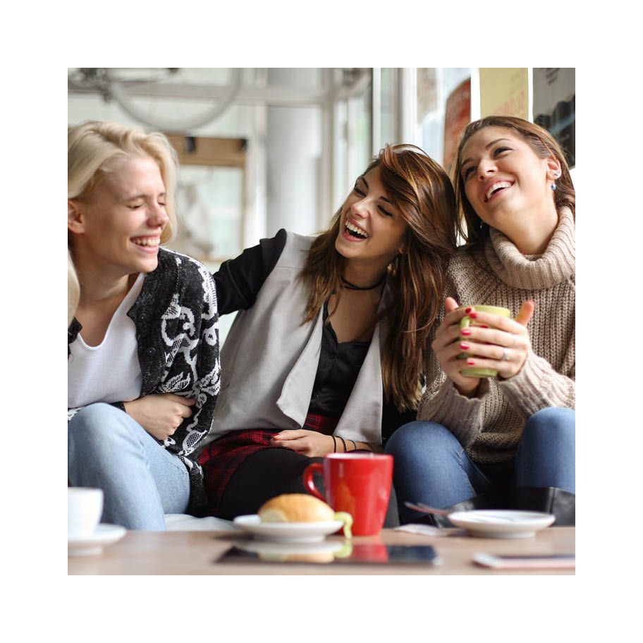 Franke Coffee Systems women in café, having a good time, coffee on table