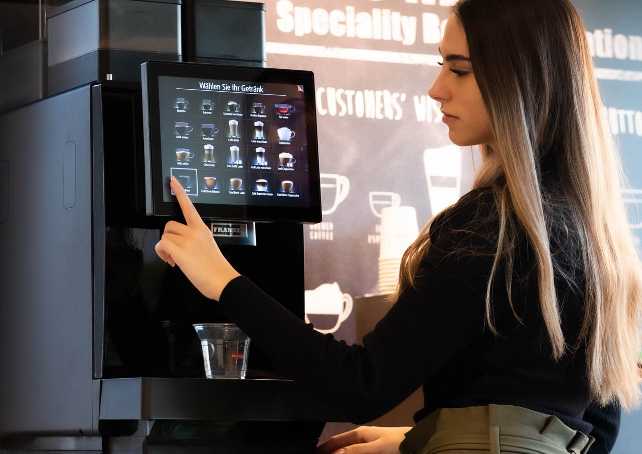 Franke Coffee Systems, fully automatic coffee machine Franke SB1200, woman choosing her coffee