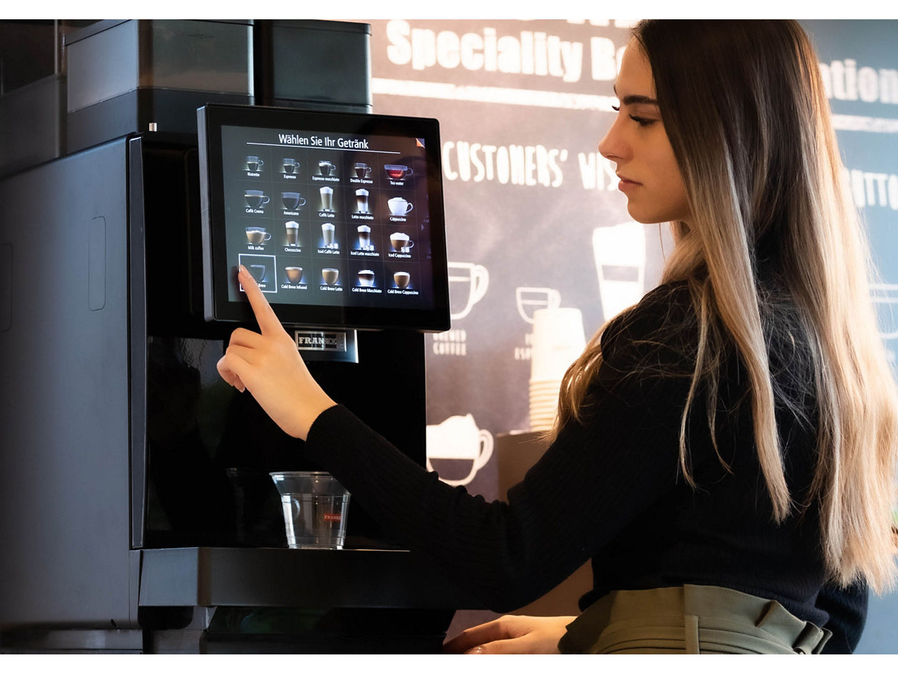 Franke Coffee Systems, fully automatic coffee machine Franke SB1200, woman choosing her coffee