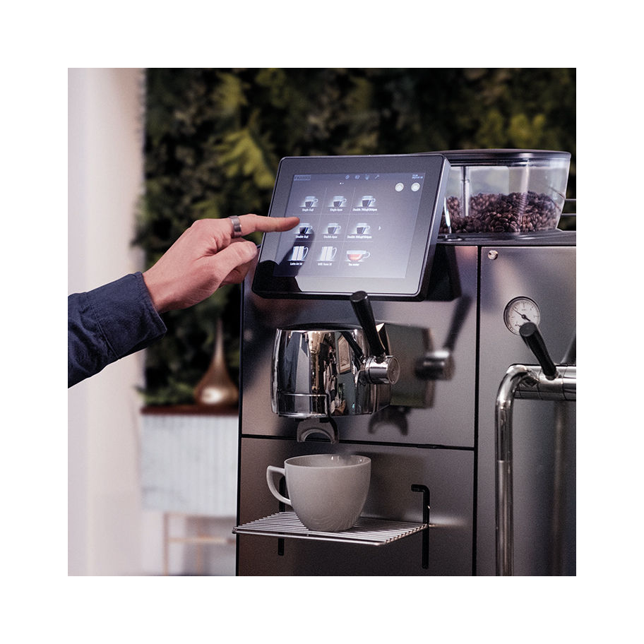 Franke Coffee Systems, Mytico, BeyondTraditional fully automatic and hybrid coffee machine, touchscreen, barista selecting beverage