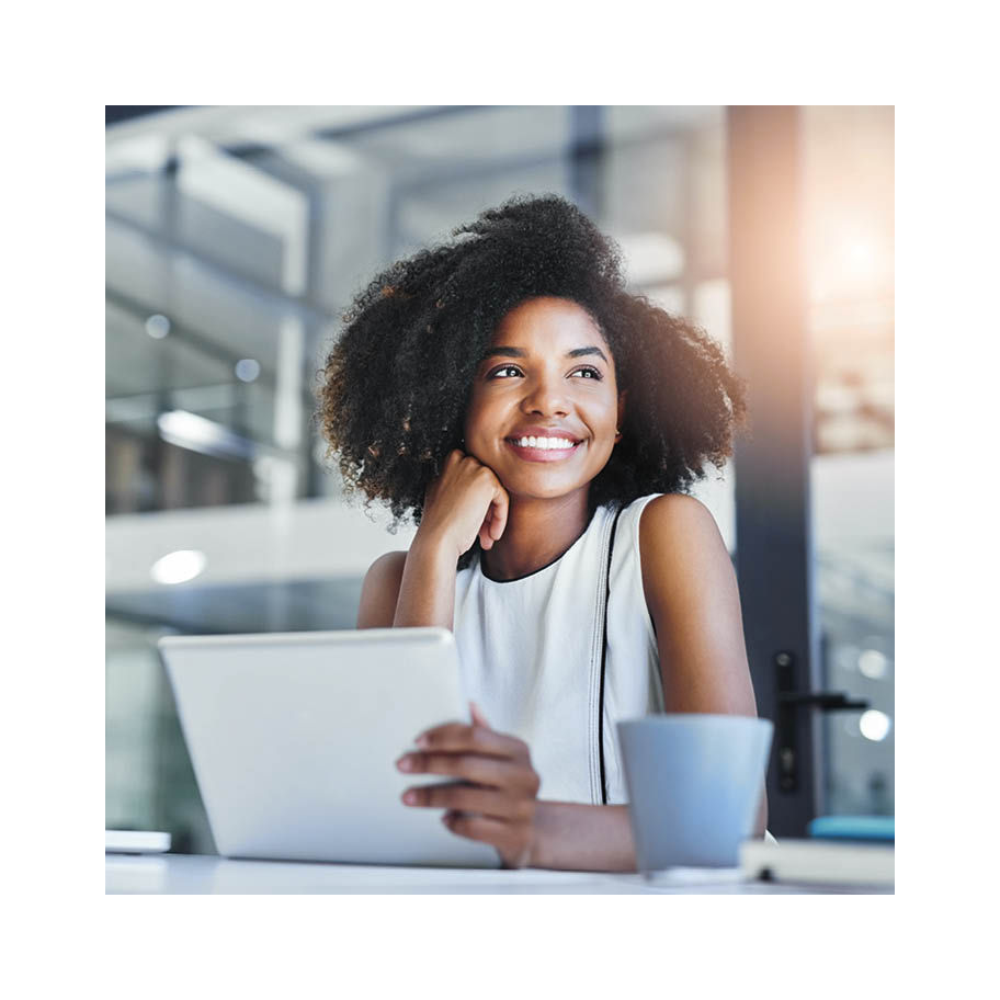 Franke Coffee Systems, working woman, business woman, on laptop with cup of coffee