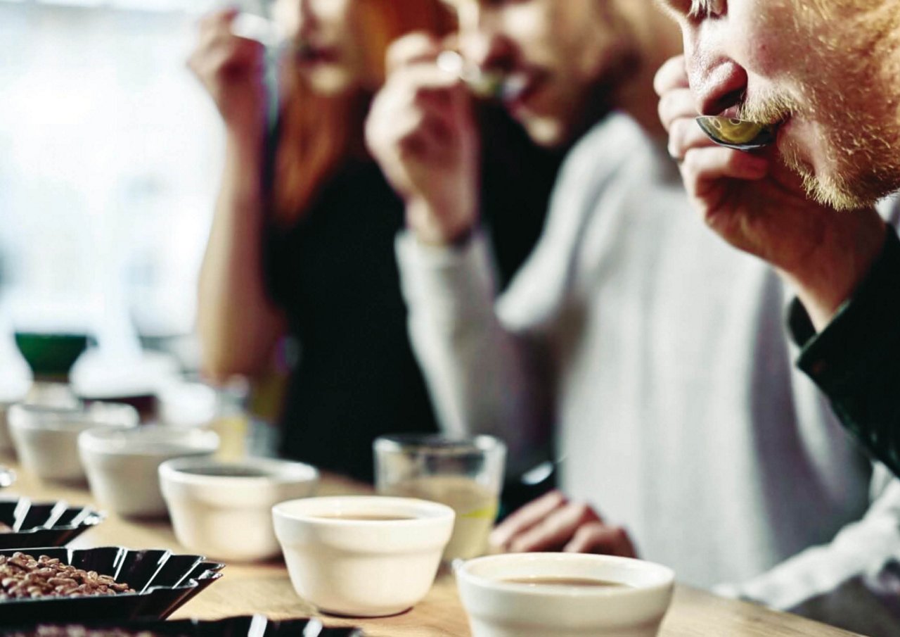 Franke Coffee Systems, goup of people tasting coffee with a spoon