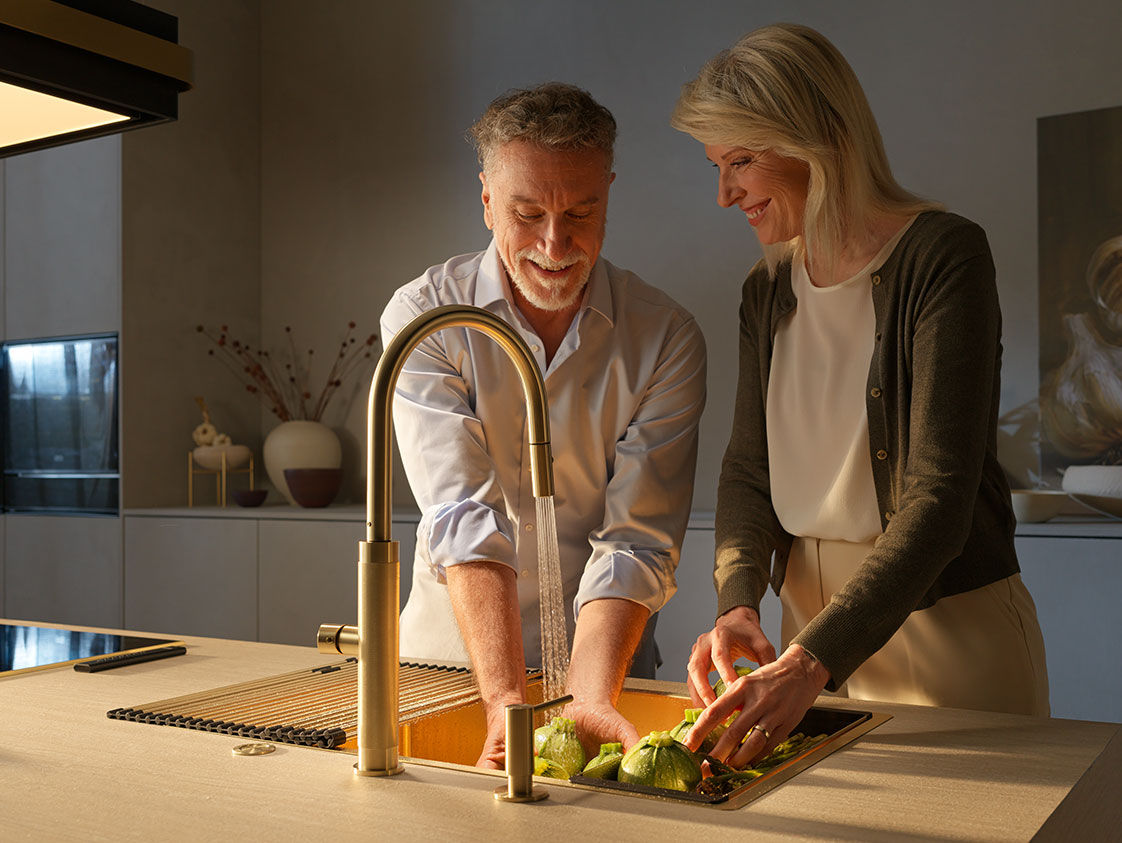 Couple using the Franke kitchen tap