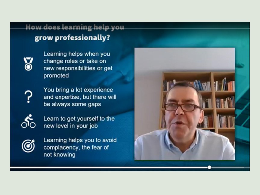 A person in a video call presentation titled How does learning help you grow professionally? is speaking. Points covered include role changes, gaining experience, self-improvement, and avoiding complacency. A bookshelf is in the background