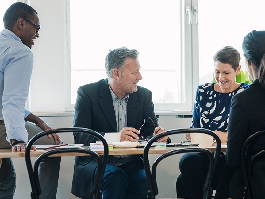 four people around a table