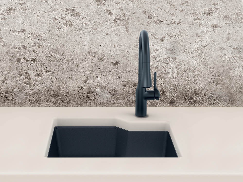 Kindred matte black granite undermount sink in a beige counter