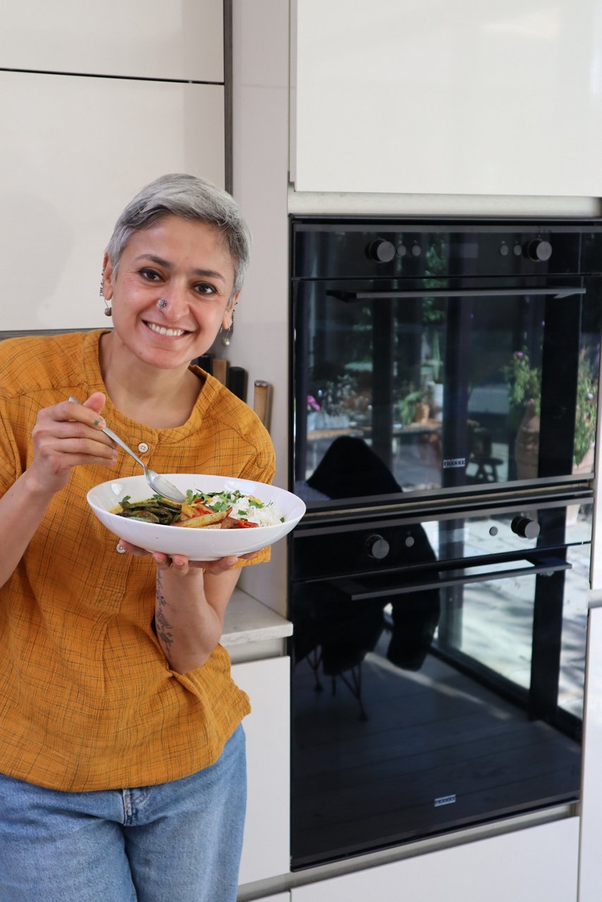 Chetna enjoying her recipe cooked in the Franke kitchen
