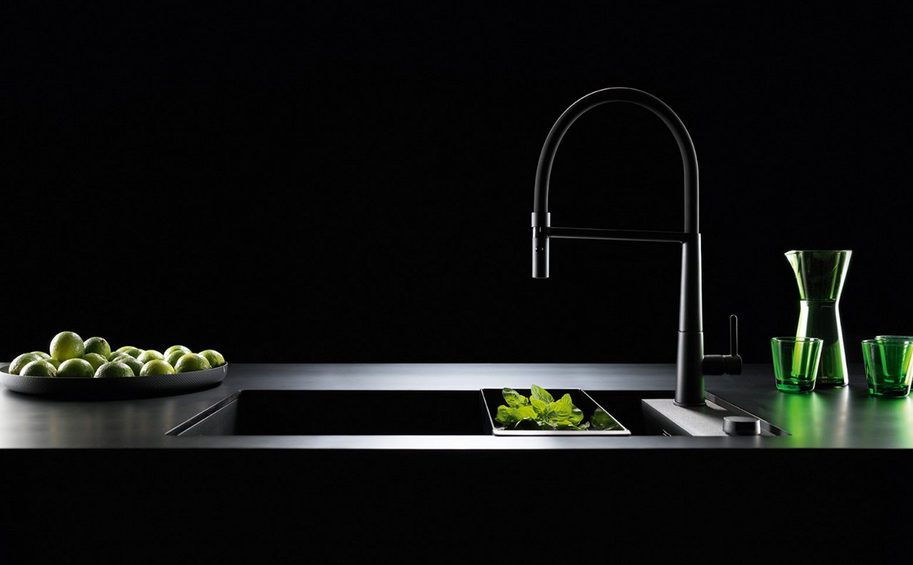 Icon Semi Pro Matte Black kitchen faucet paired with Matte black granite sink in a modern dark kitchen.