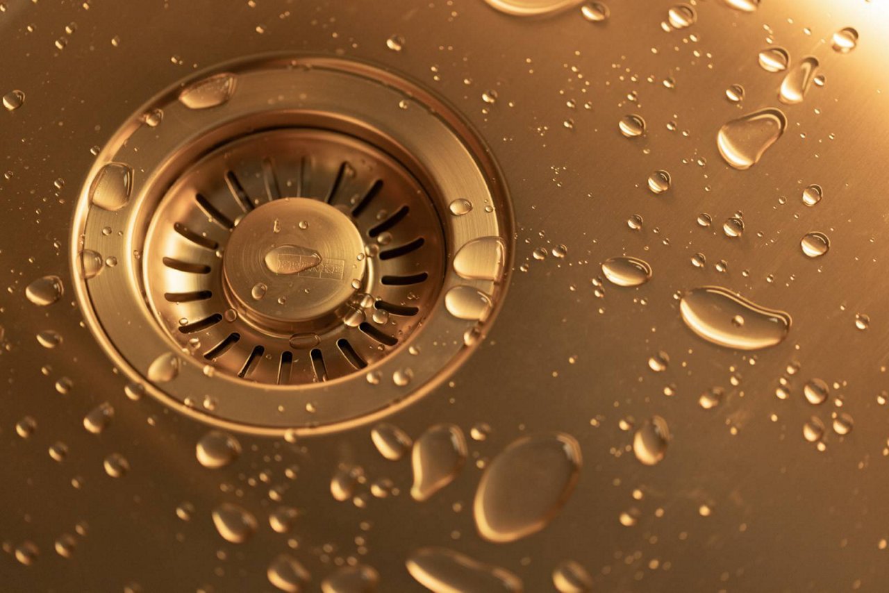 Sink close up of waste in stainless steel colored material