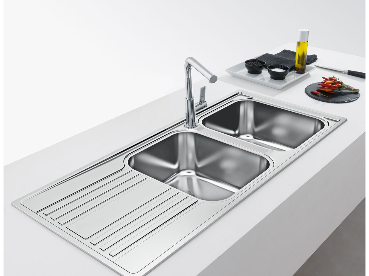 Sensor activated mixer installed over stainless steel sink