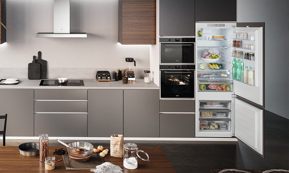 Kitchen with an open Refrigerator containing various sorts of food