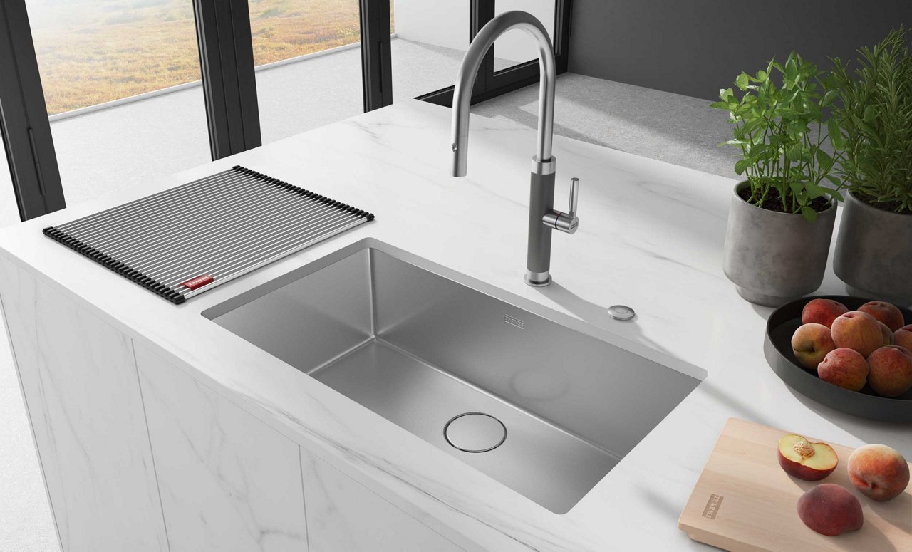 Franke stainless steel kitchen sink with accessories and matching steel tap