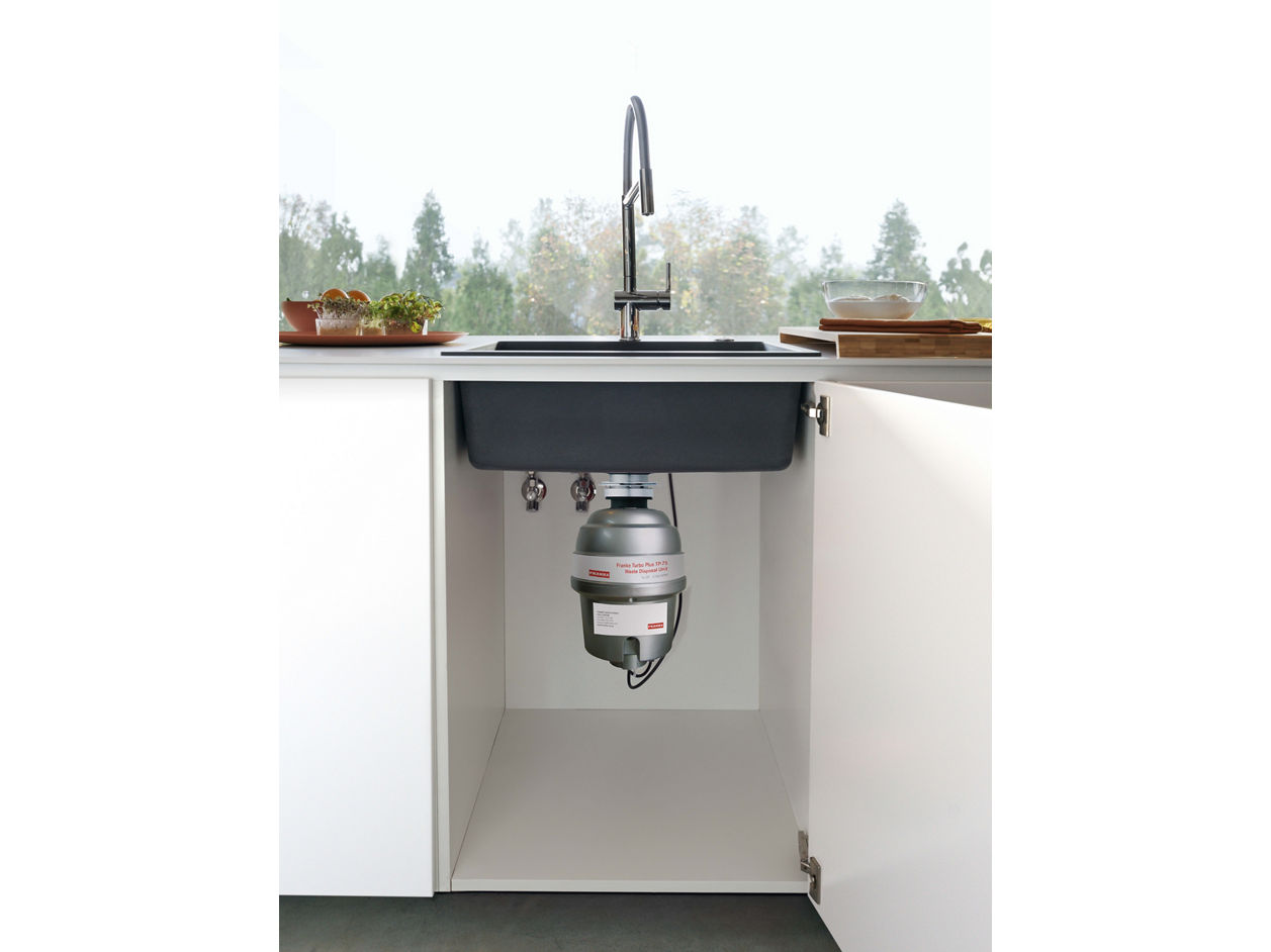 undercounter shot of waste disposer