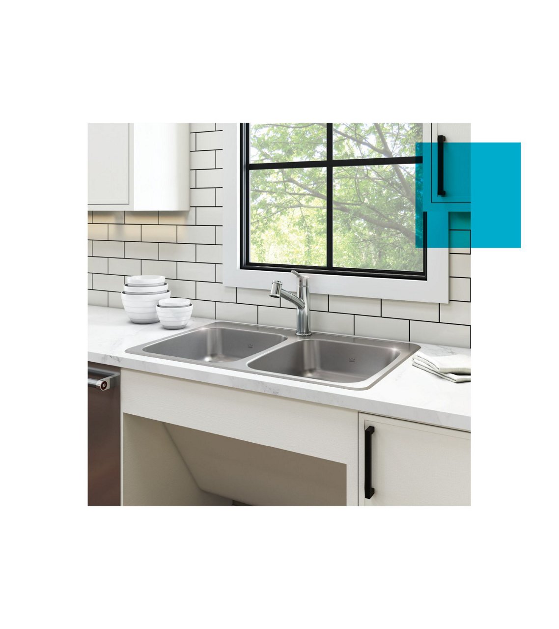 Double bowl ADA kitchen sink with pull out faucet in a bright white accessible kitchen with subway tile.
