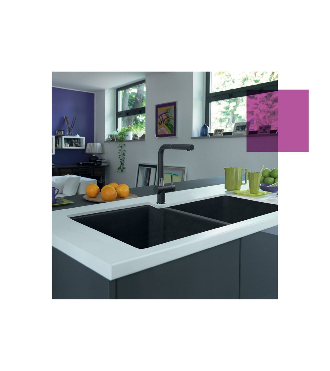Kindred double bowl matte black granite sink with a matching black faucet in a kitchen island