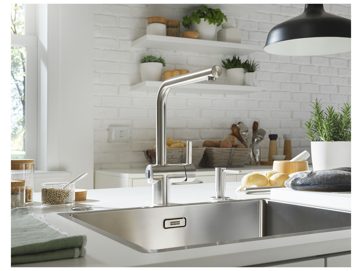 Sensor activated mixer installed over stainless steel sink