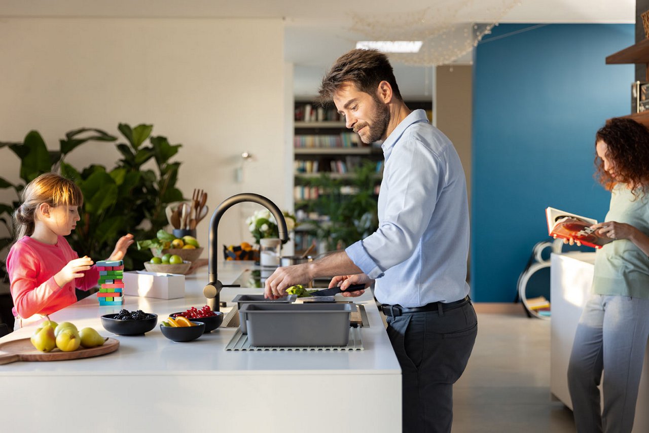Family gathered around a kitchen island
