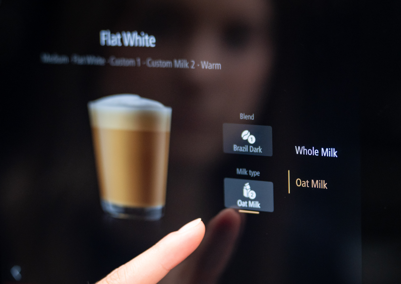 Franke Coffee Systems, coffee machine screen interface, menu, close-up customer ordering flat white, milk choice