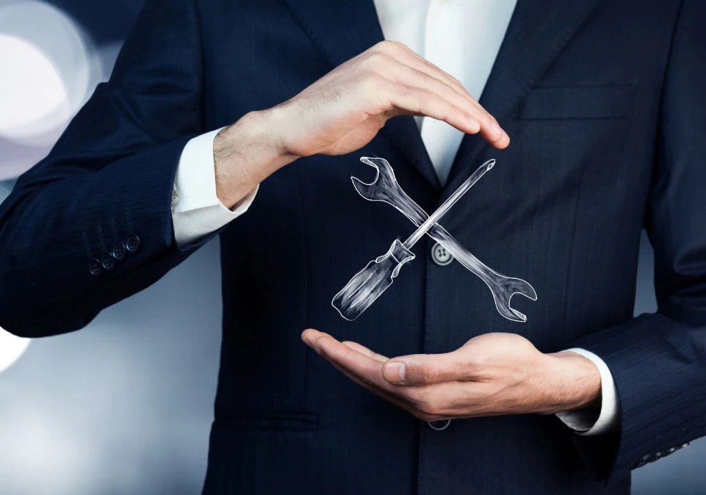 Man wearing a suit with wrench and screwdriver - Franke