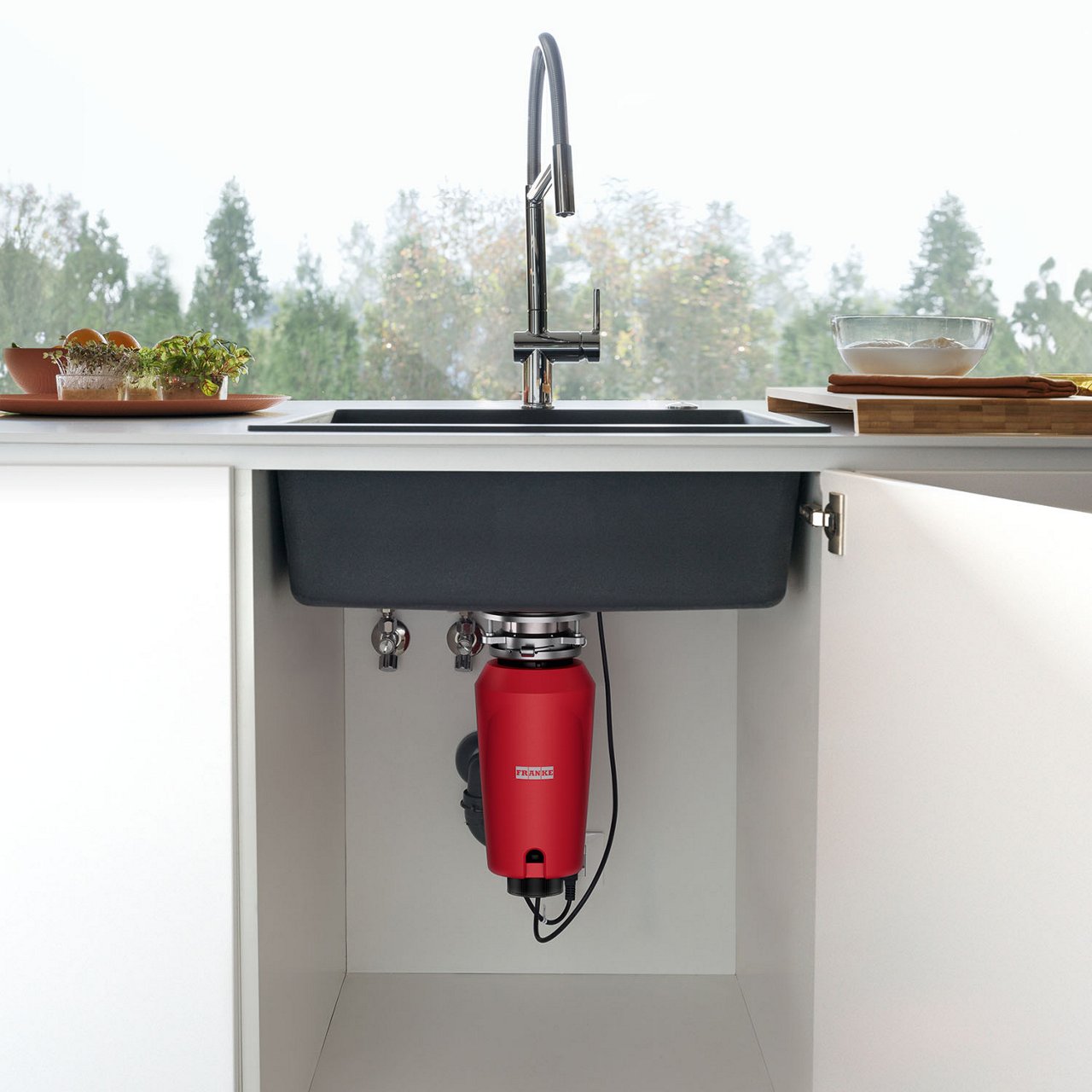 Franke food waste disposer installed under the kitchen sink