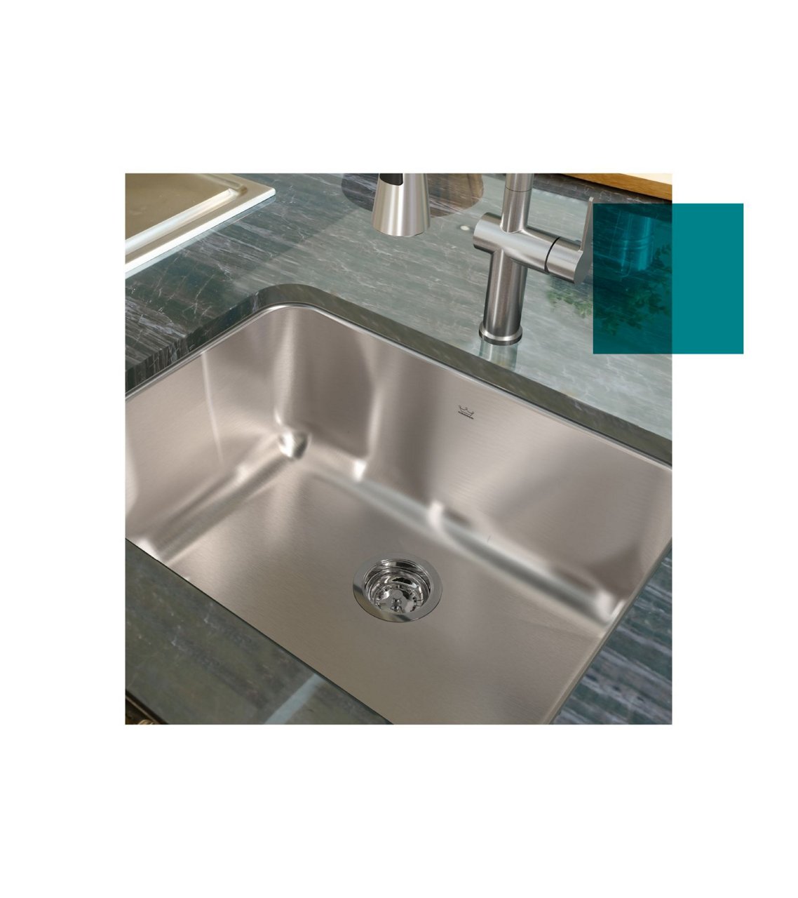 single bowl stainless steel Kindred sink in a green marble countertop
